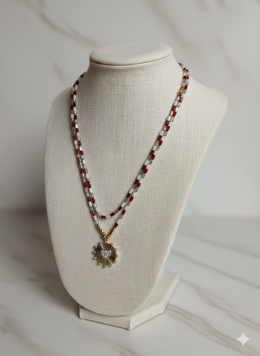 Necklace with a sunflower pendant on a mannequin bust against a neutral background